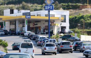 Vehicles queue for fuel at a gas station in the village of Msayleh