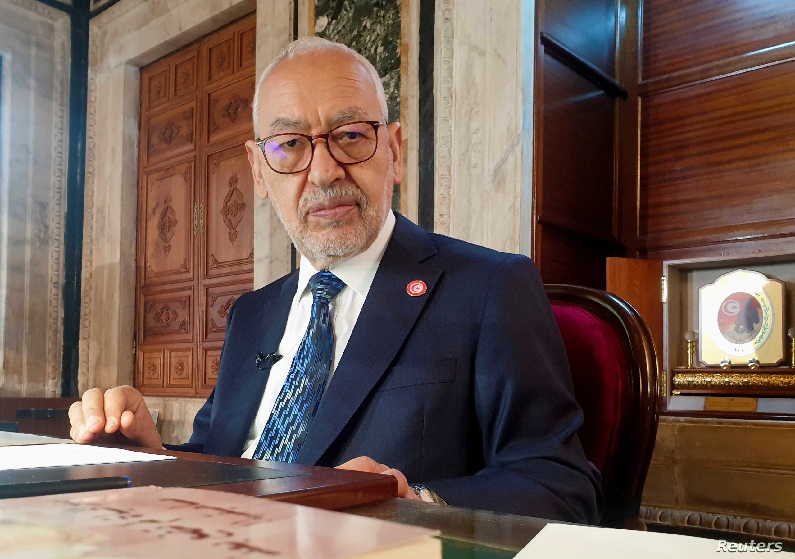 FILE PHOTO: Parliament Speaker Rached Ghannouchi poses during an interview with Reuters in his office, in Tunis