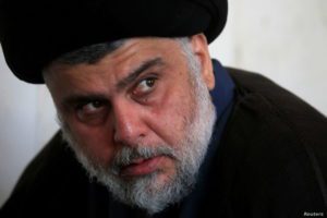 FILE PHOTO: Iraqi Shi'ite cleric Muqtada al-Sadr attends Friday prayers at the Kufa mosque in Najaf