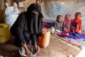 Yemen. Hayat prepares bread using WFP flour