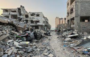 Houses destroyed in Israeli strikes during the conflict lie in ruin, in Beach refugee camp, in Gaza City