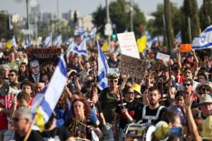People attend a demonstration calling for the immediate return of hostages held in Gaza, outside Prime Minister office in Jerusalem