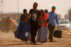 المنظمة الدولية للهجرة: نحو 450 ألف أفغاني عادوا من إيران منذ الأول من حزيران/يونيو
