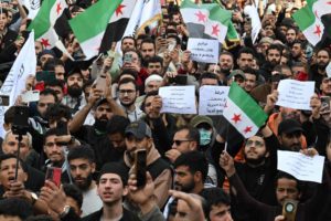مظاهرات في سوريا احتفالاً بمرور عام على بدء معركة إطاحة الأسد (صور)